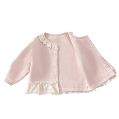 Inside view of the soft pink baby girl knit cardigan showing the continuous ruffled lace trim along the bottom hem and neckline.