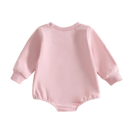 Back view of the plain pink baby girl long sleeve bubble romper.