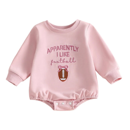 Front view of a pink baby girl long sleeve bubble romper featuring the text