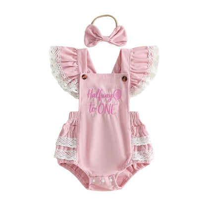Pink baby girl "Halfway to One" 6-month birthday romper outfit with matching bow headband, featuring lace ruffle sleeves.