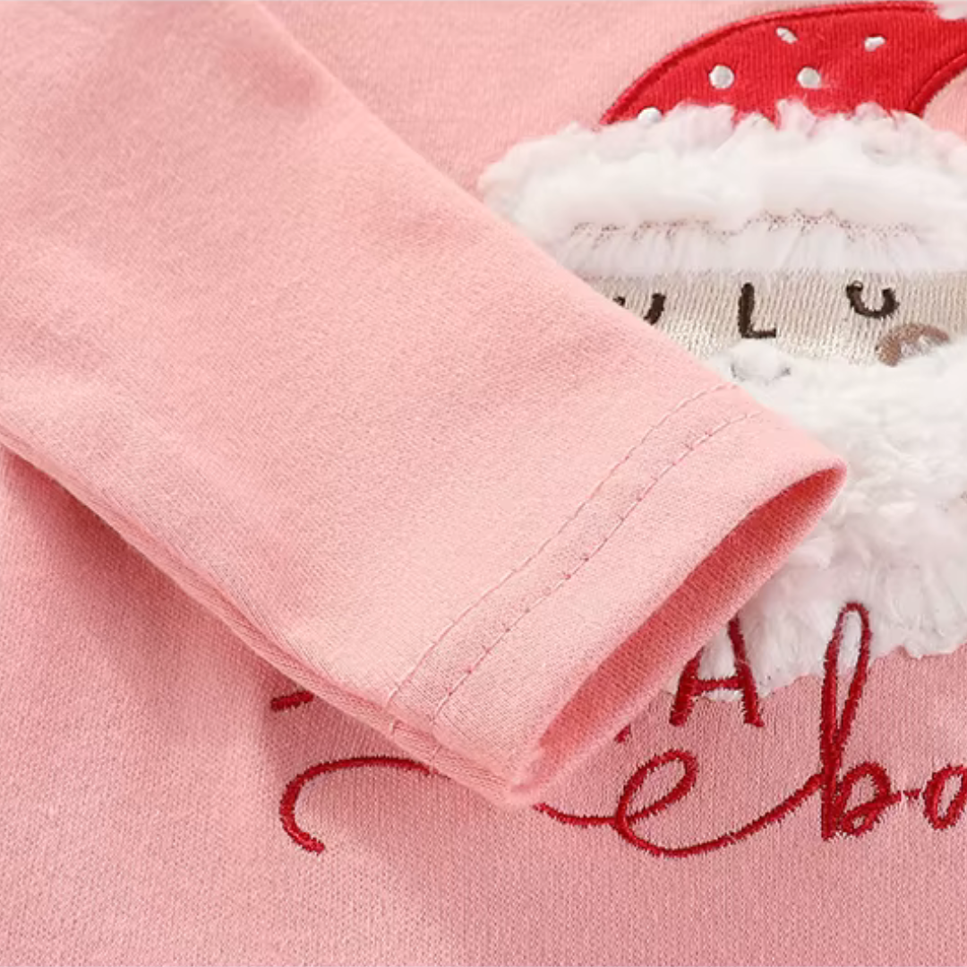 Close-up detail of soft pink long sleeve wrist cuff on baby Christmas bodysuit