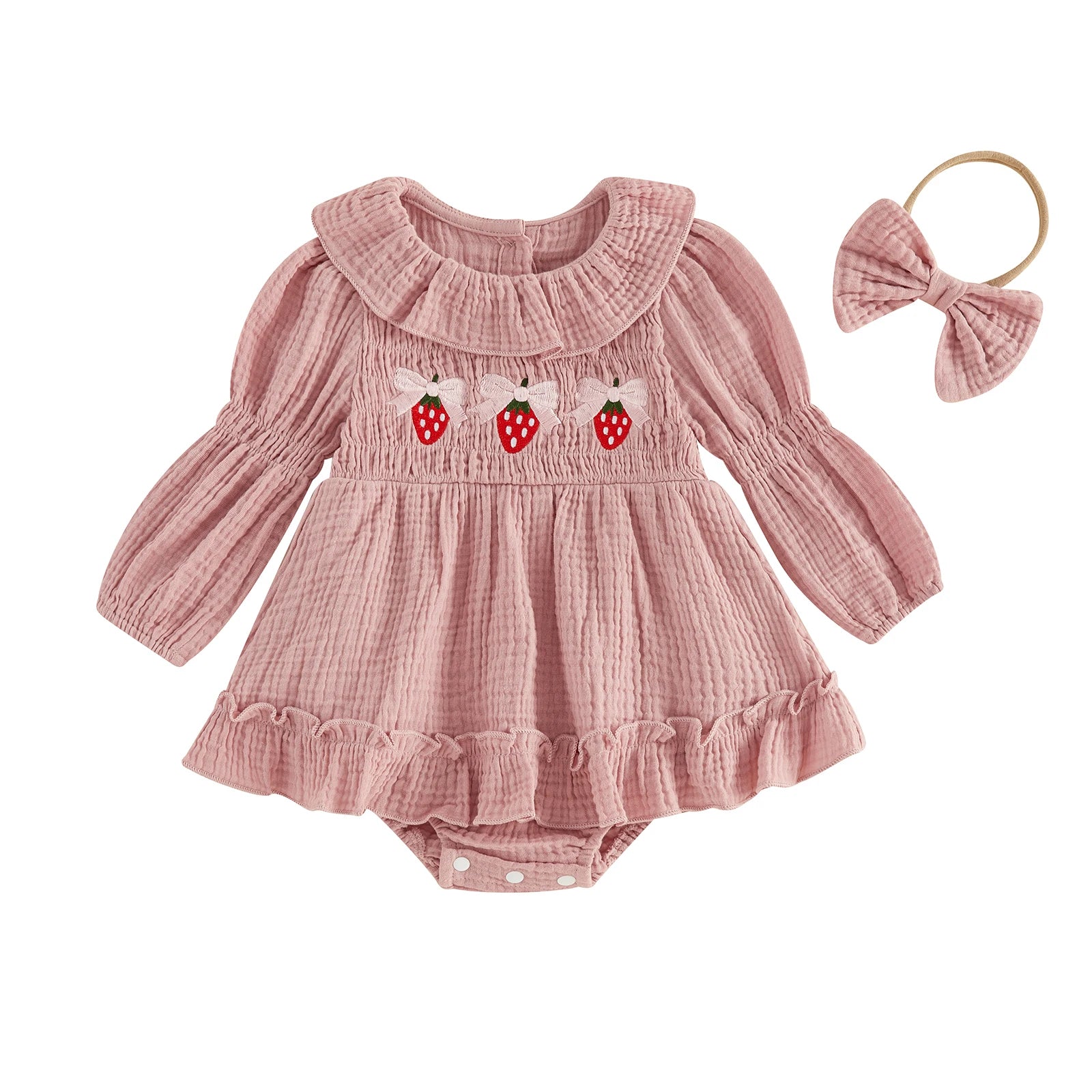 Front view of a baby girl pink long-sleeve smocked bubble romper with strawberry embroidery and a matching bow headband on a white background.