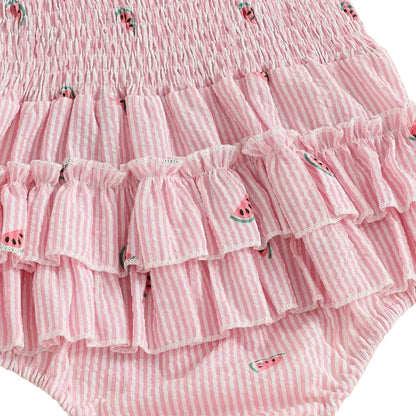 Full rear view studio shot of the baby girl romper on a white background, displaying the ruffle butt and smocked back panel.