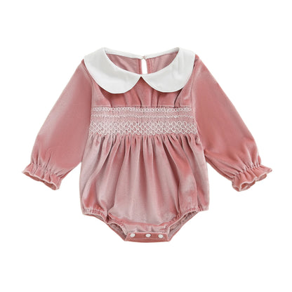 Baby girl pink velvet smocked bubble romper with white Peter Pan collar and bottom snap closures