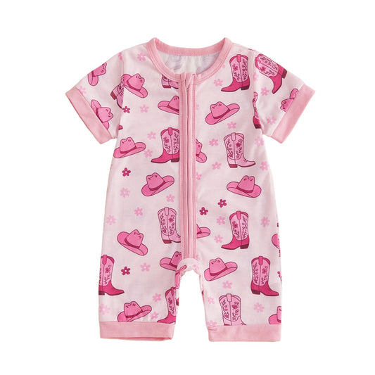 Front view of an infant baby girl short sleeve pink zip-up romper featuring a western cowgirl hat and boot print on a white background.