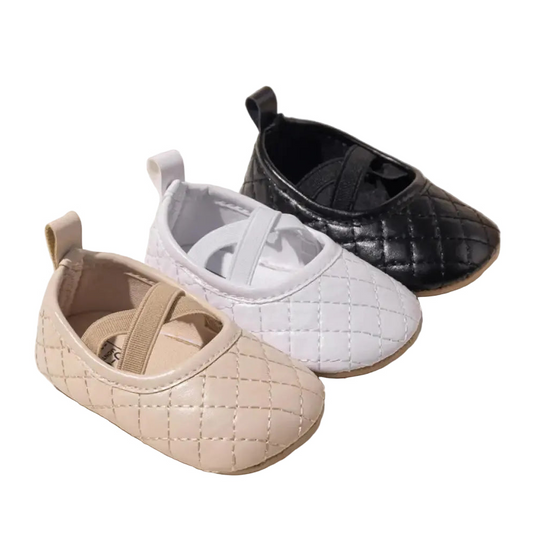 Three pairs of Kidsely baby girl quilted PU leather ballet flats shown in beige, white, and black with elastic cross-straps.