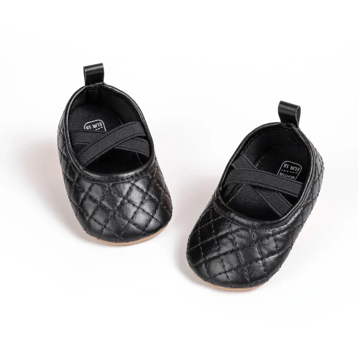 Top-down view of Kidsely black quilted baby girl pre-walker shoes featuring a comfortable elastic cross-strap.