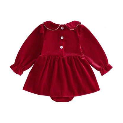Back view of a baby girl red holiday romper dress displaying upper button closures and a Peter Pan collar.