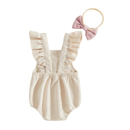 Back view of baby girl ruffle shoulder strap birthday romper outfit with matching pink bow headband.