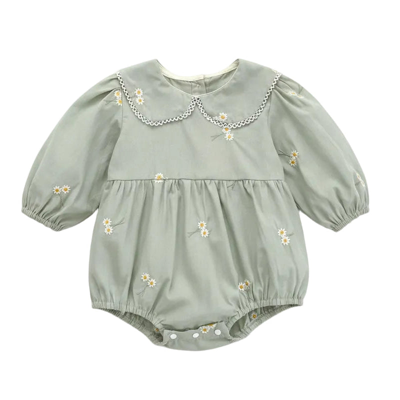 Front flat lay view of a sage green baby girl bubble romper featuring white daisy floral embroidery and a scalloped lace Peter Pan collar.