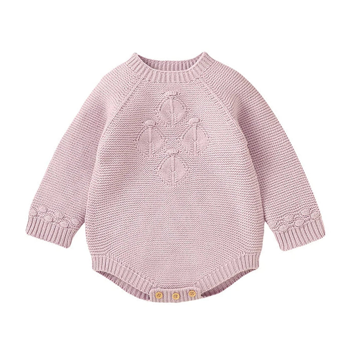 Baby girl seamless knit sweater romper in light pink featuring vintage-inspired diamond lattice chest detail and long sleeves.
