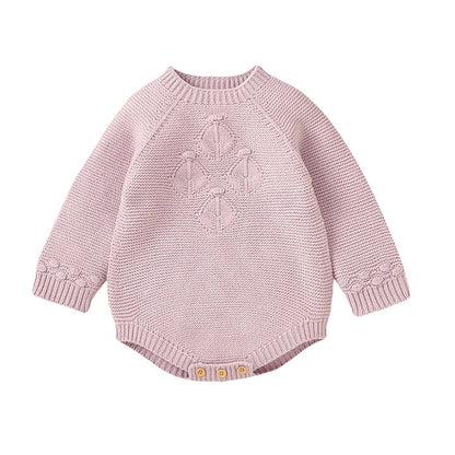 Baby girl seamless knit sweater romper in light pink featuring vintage-inspired diamond lattice chest detail and long sleeves.