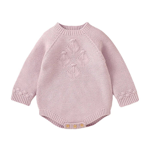 Baby girl seamless knit sweater romper in light pink featuring vintage-inspired diamond lattice chest detail and long sleeves.