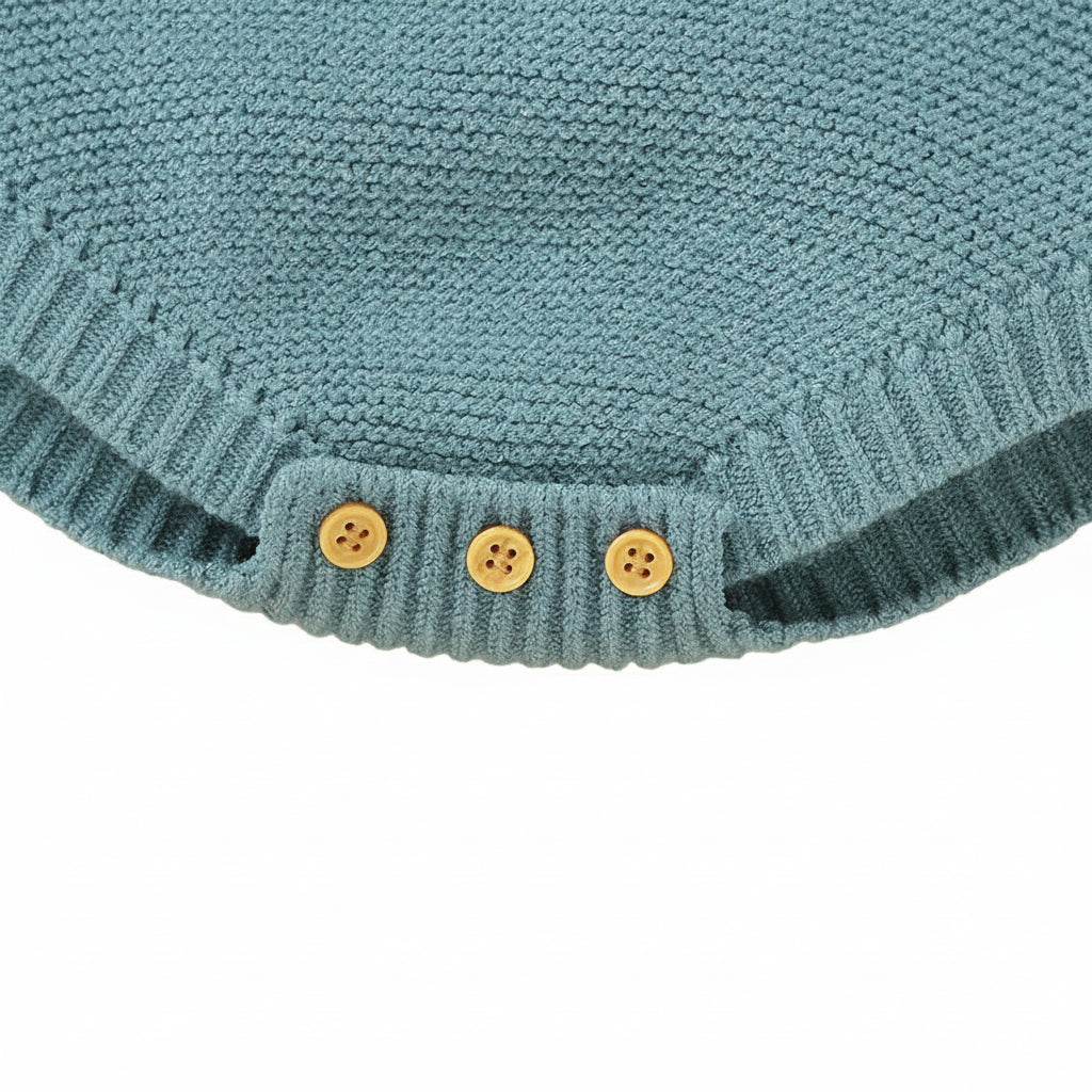 Close-up of the sturdy bottom snap button closures on the leg opening for easy diaper changes.