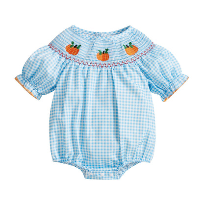 Light blue smocked gingham baby romper with embroidered pumpkins across the neckline.