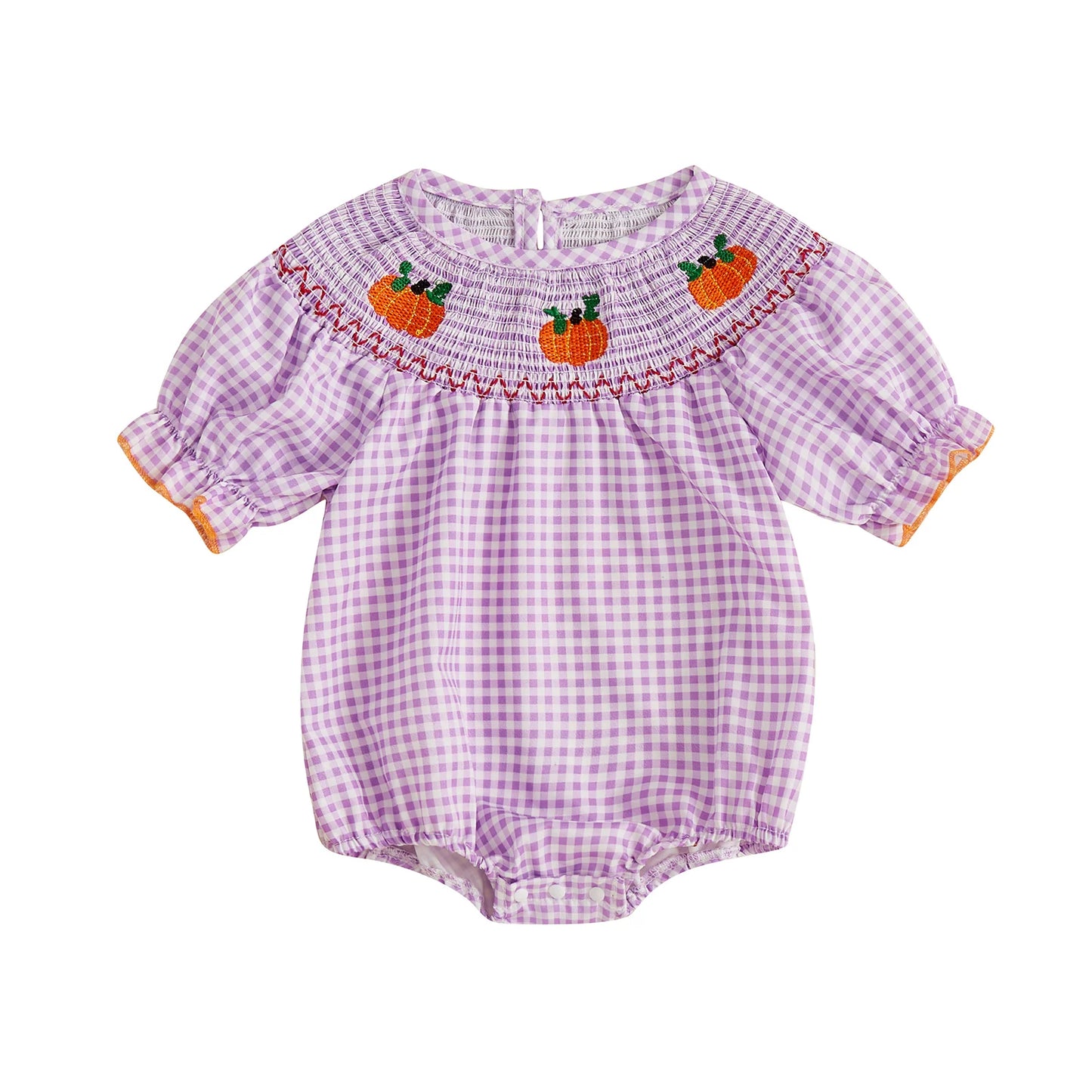 Purple smocked gingham baby romper with embroidered pumpkins across the neckline.