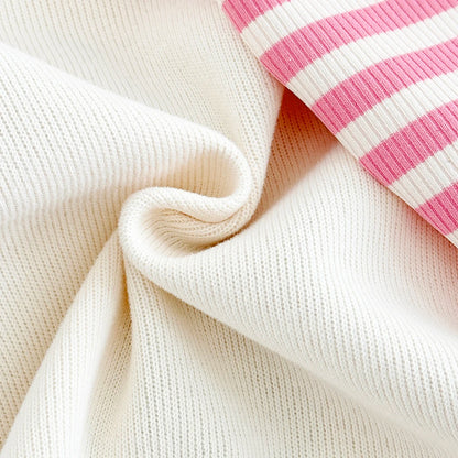Close-up showing the soft, high-quality worsted polyester knit fabric texture of the sweatshirt and pants set.