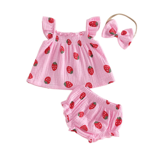 Baby girl 3-piece summer outfit featuring a light pink strawberry berry print babydoll top, ruffle bloomers, and matching bow headband.