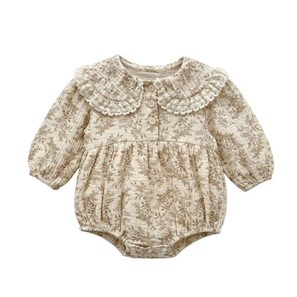 Baby girl vintage cottagecore floral long sleeve bubble romper with lace Peter Pan collar flat lay on white background.