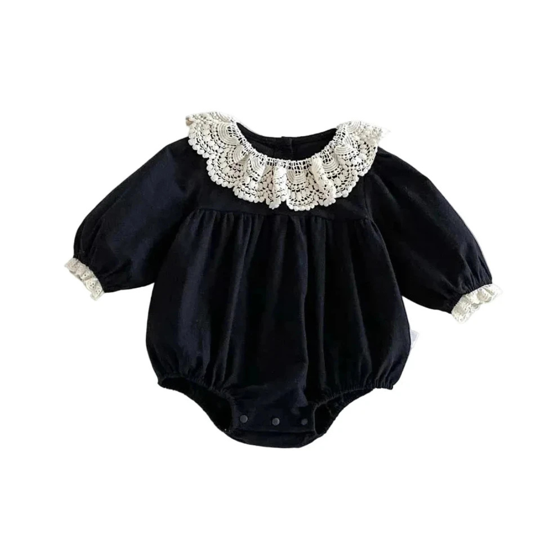 Black long sleeve baby girl vintage-inspired bubble romper with white lace Peter Pan collar flat lay