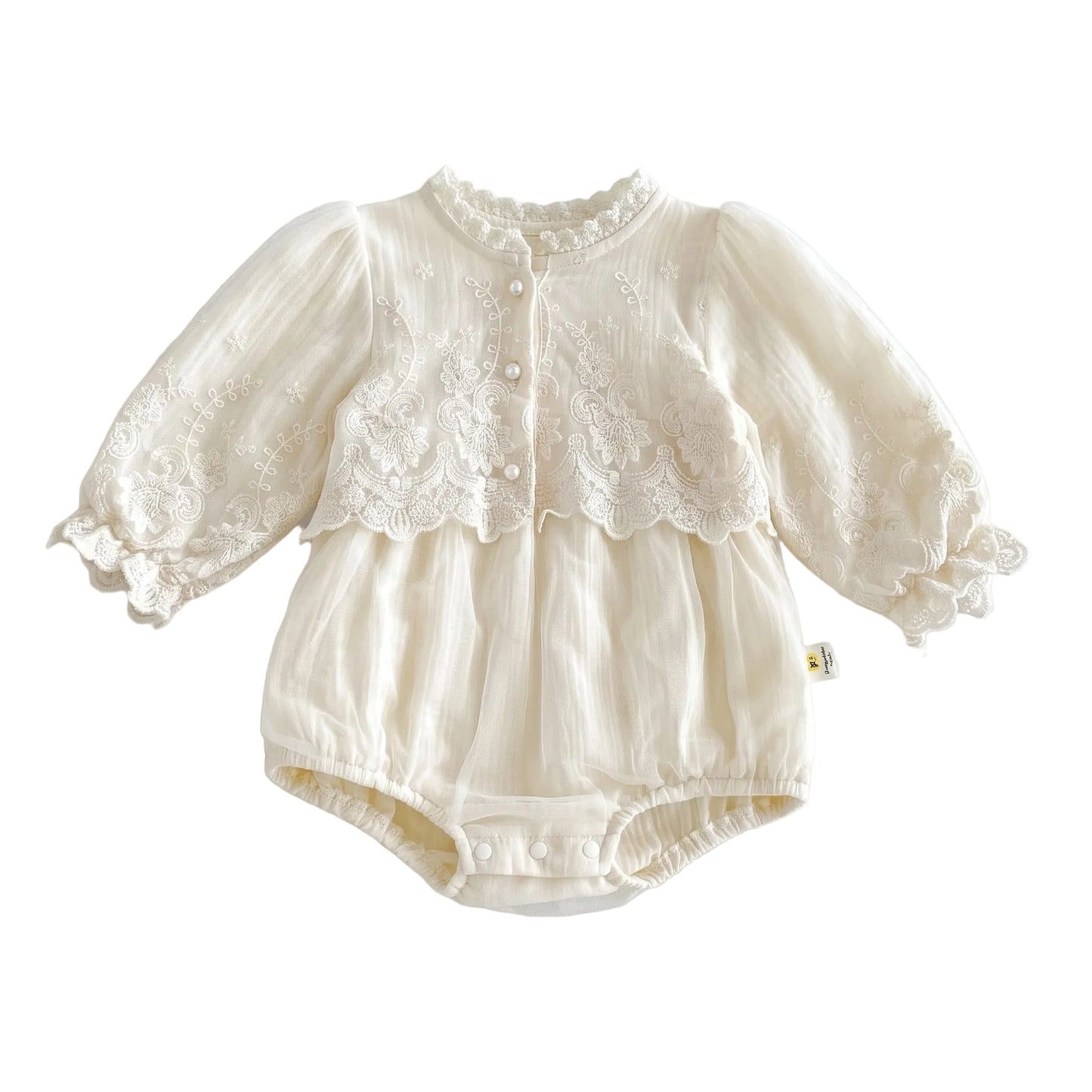 Baby girl vintage-inspired long sleeve lace embroidery bubble romper in ivory with pearl buttons and elastic leg openings.