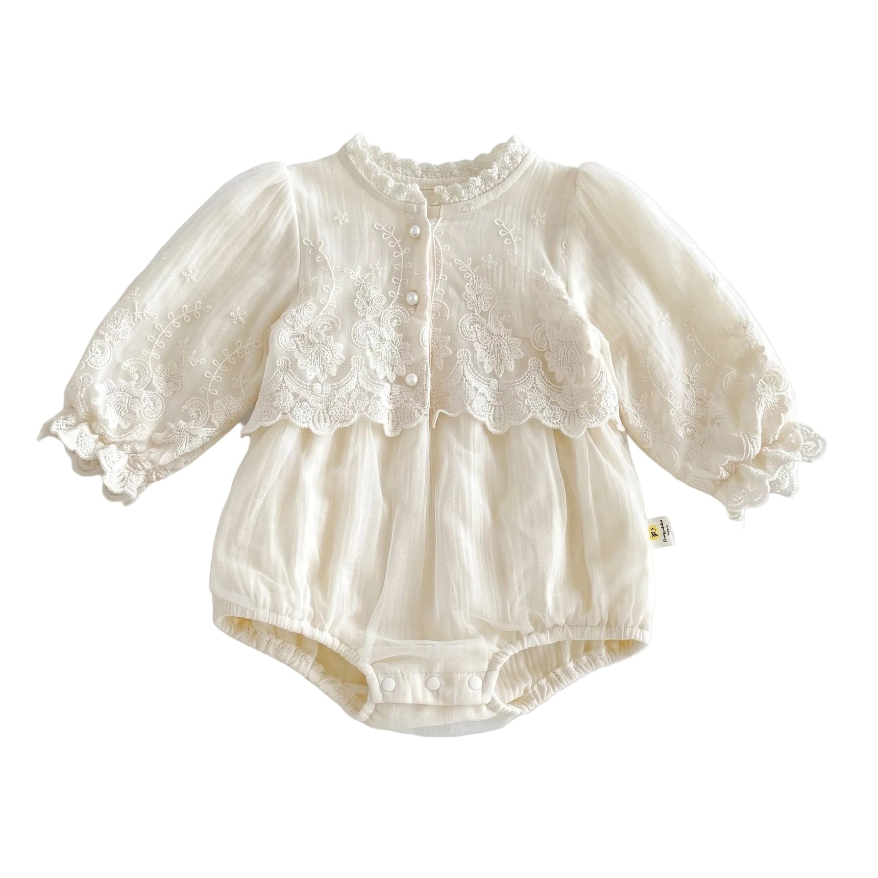 Baby girl vintage-inspired long sleeve lace embroidery bubble romper in ivory with pearl buttons and elastic leg openings.