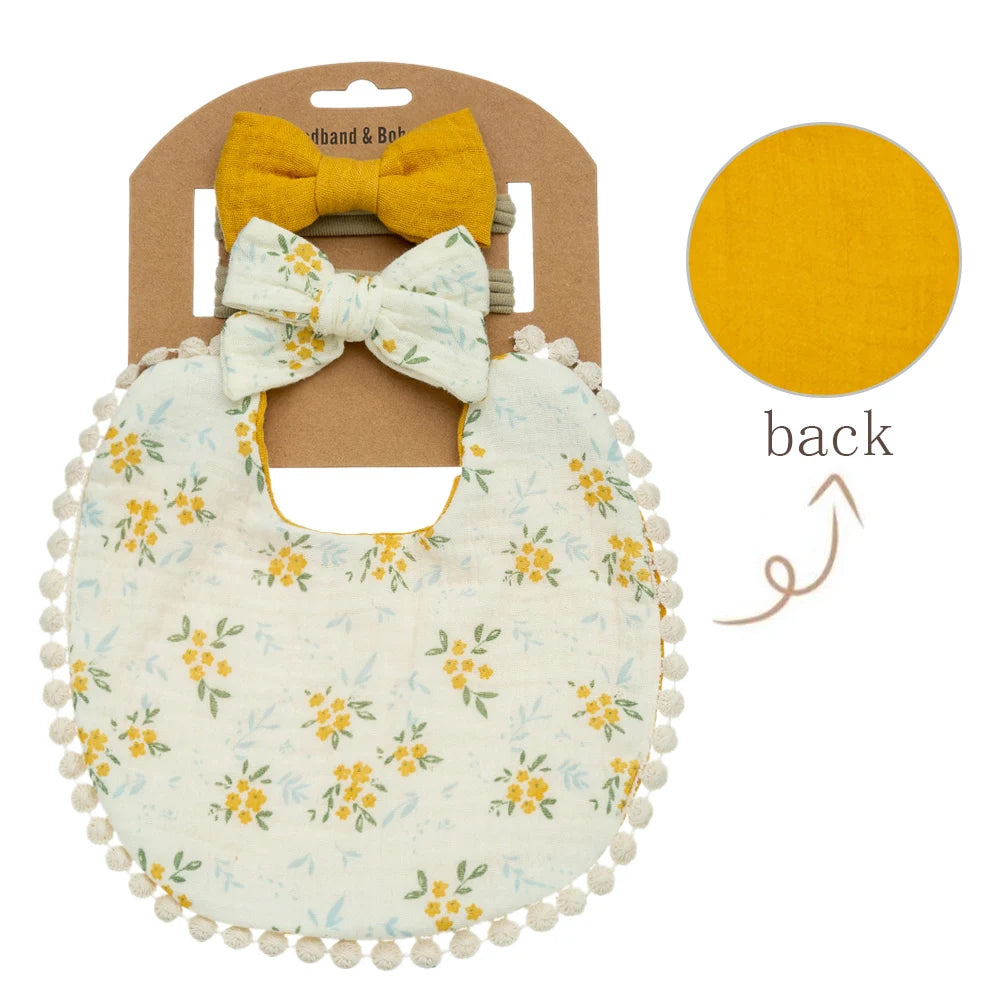 Vintage mustard yellow marigold floral muslin bib and matching yellow bow headbands for baby girls.