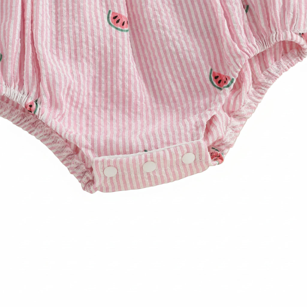 Close-up of the bottom opening of the romper, showing the reinforced snap closures for diaper changes.