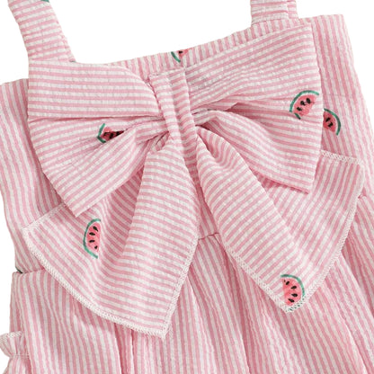 Close-up detail of the bodice on the baby girl watermelon romper, focusing on the large front bow and seersucker fabric texture.