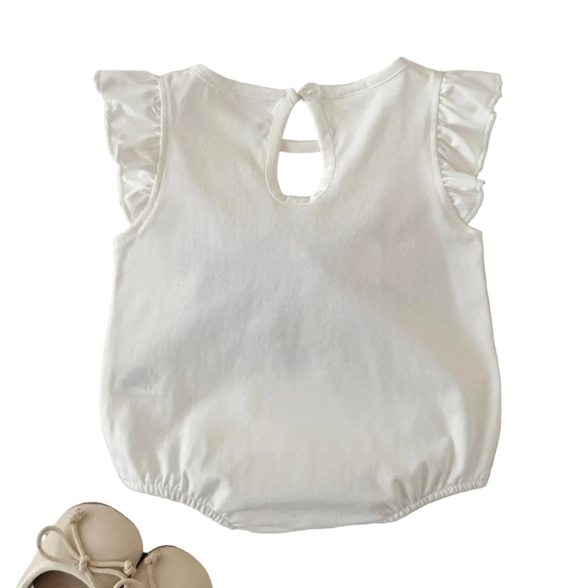 The back view of the white knitted baby bodysuit showing the clean design, flutter sleeves, and keyhole button closure at the top.