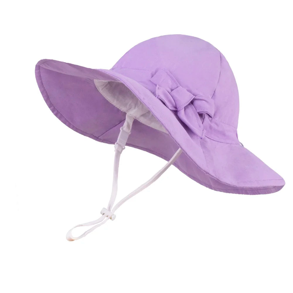 Lavender purple 100% cotton wide brim sun hat for toddler girls with an adjustable chin strap.
