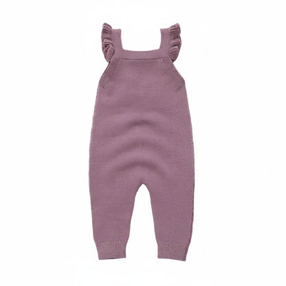 Back view of a mauve sleeveless chunky knit baby romper laying flat on a white background.