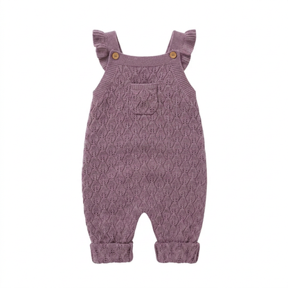 Baby girls mauve chunky knit sleeveless romper overalls with ruffle straps and a front pocket, laying flat on a white background.