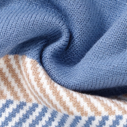 Close-up macro detail of the ultra-soft, breathable core-spun viscose yarn fabric texture on the sky blue baby sweater jumpsuit.