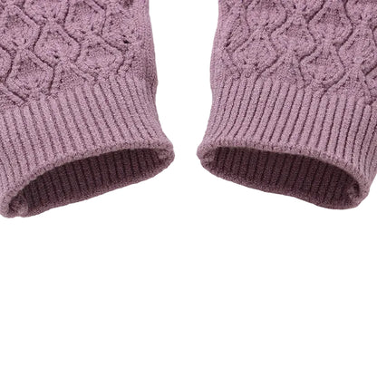 Close-up of the stretchy ribbed knit ankle cuffs on a cozy mauve baby romper.