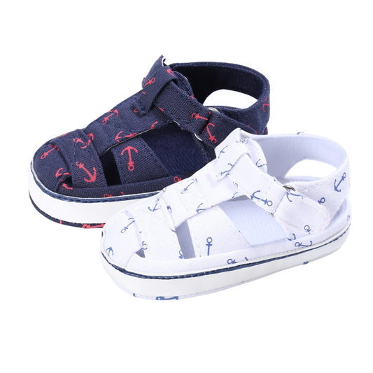 Navy blue and crisp white baby canvas summer boat shoes featuring a nautical anchor print.