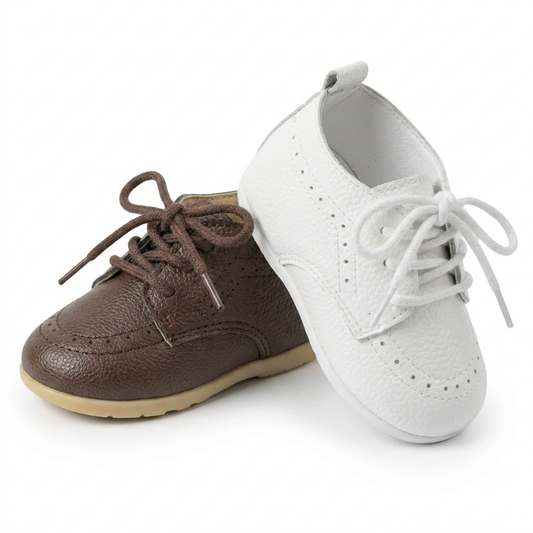 Group shot of Kidsely pebbled faux leather baby brogue oxford dress shoes in textured brown and white with lace-up closures.