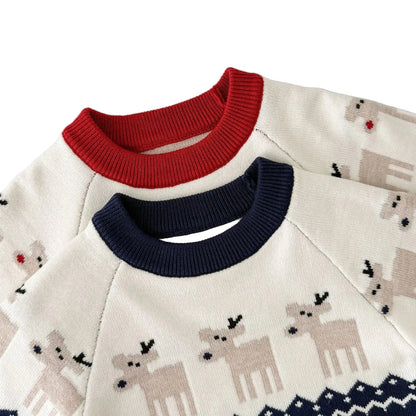Close-up of the neckline and reindeer knit pattern on the red and navy baby winter rompers.