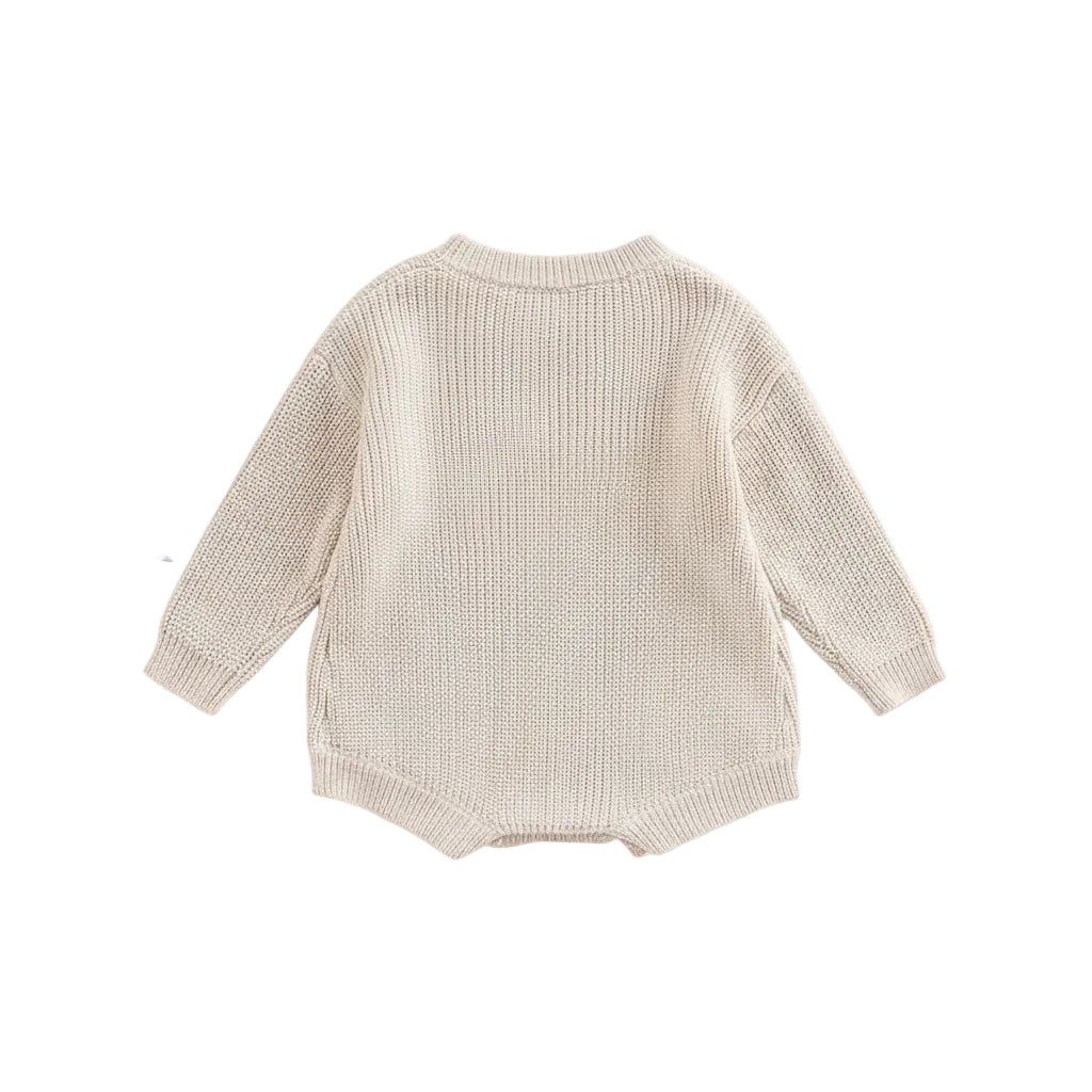 Back view of unisex baby ribbed cotton blend knit sweater romper in cream.