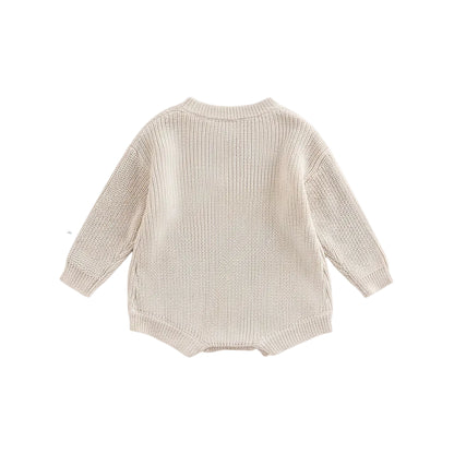 Back view of unisex baby ribbed cotton blend knit sweater romper in cream.