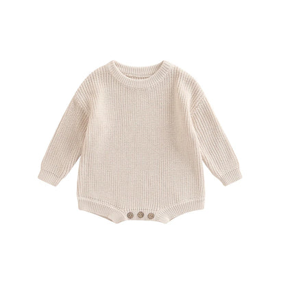 Unisex baby ribbed cotton blend knit sweater romper in cream.