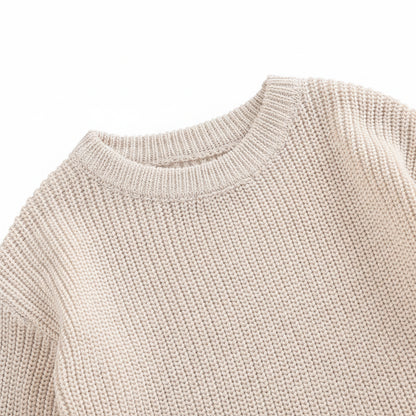 Close-up of the comfortable round crew neck collar and vertical ribbed fabric texture on the baby sweater bodysuit