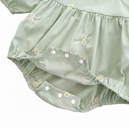 Close-up view of the open bottom crotch area showing the convenient white snap closures for easy diaper changes.