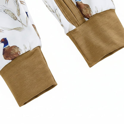 Close-up of the long sleeves and soft brown ribbed cuffs on the fall baby jumpsuit.