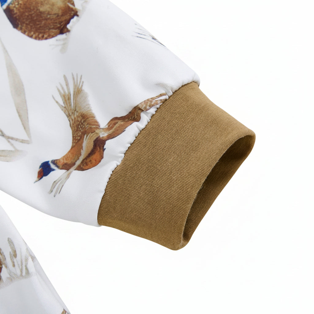 Close-up of the ankle cuff and detailed pheasant bird print on the soft cotton baby outfit.
