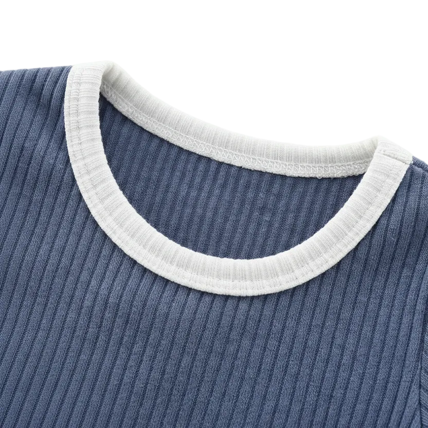 Kidsely boutique quality: Close-up of the crew neckline on the Dusty Indigo romper featuring clean stitching and Oatmeal Milk contrast trim.