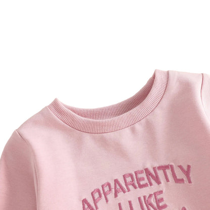 Close-up detail of the ribbed crew neckline on the pink baby girl football bubble romper.