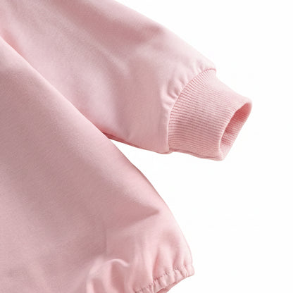 Close-up detail of the ribbed cuff on the long sleeve of the pink baby girl bubble romper.