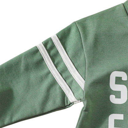 Detailed shot of the dual white athletic varsity stripes printed on the long sleeve of the sage green infant outfit.
