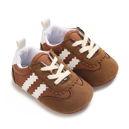 Caramel brown baby prewalker sneakers featuring classic white serrated three-stripe design and supportive soft sole for early walkers.